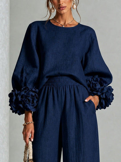 Navy Top Featuring Striking Floral Cuffs Paired with Wide Leg Pants Suit – Sienna Noosa
